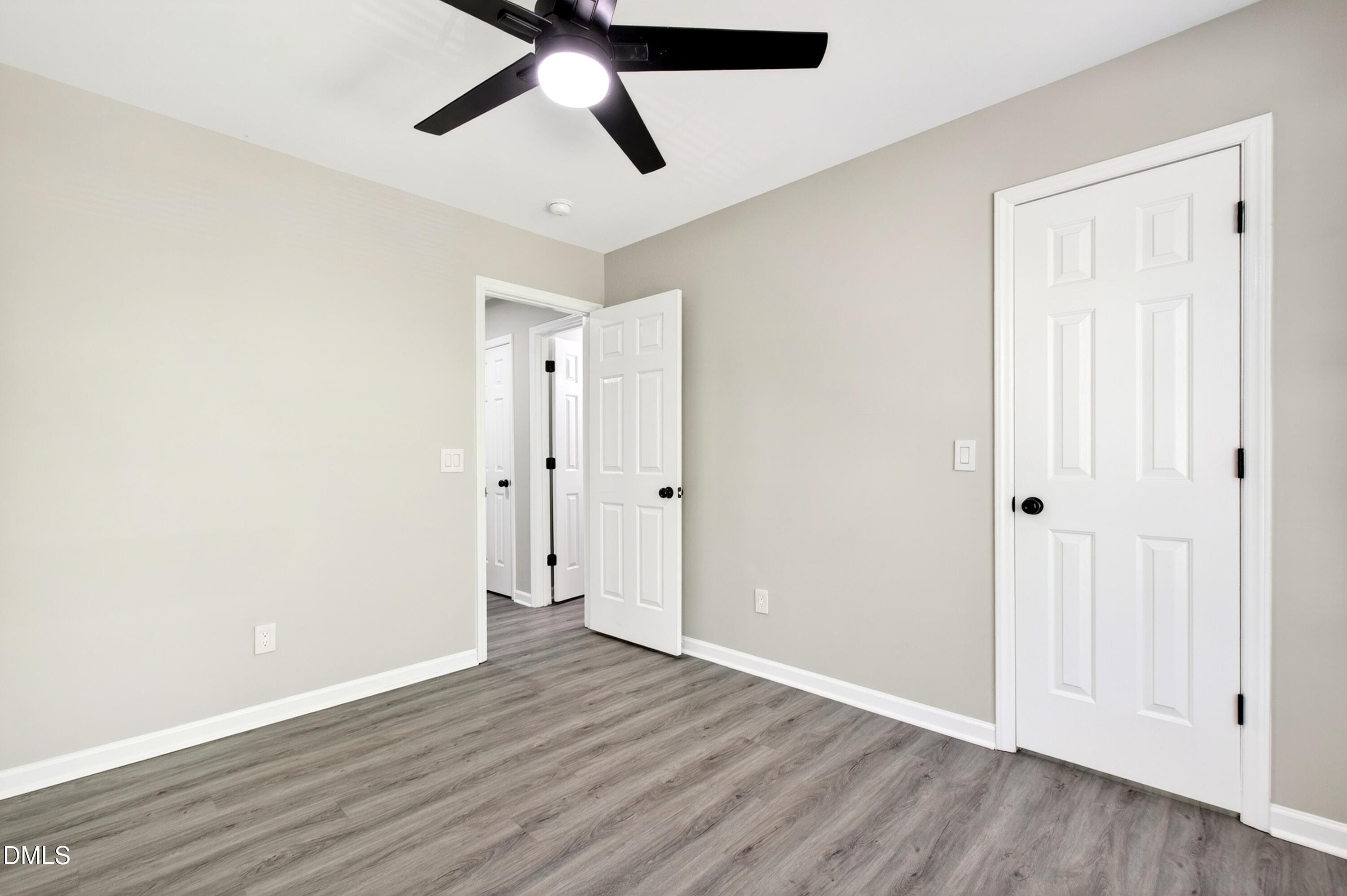 37 Red Lane Raleigh, NC 27606 - Photo 14 of 32 an empty room with wooden floor and windows