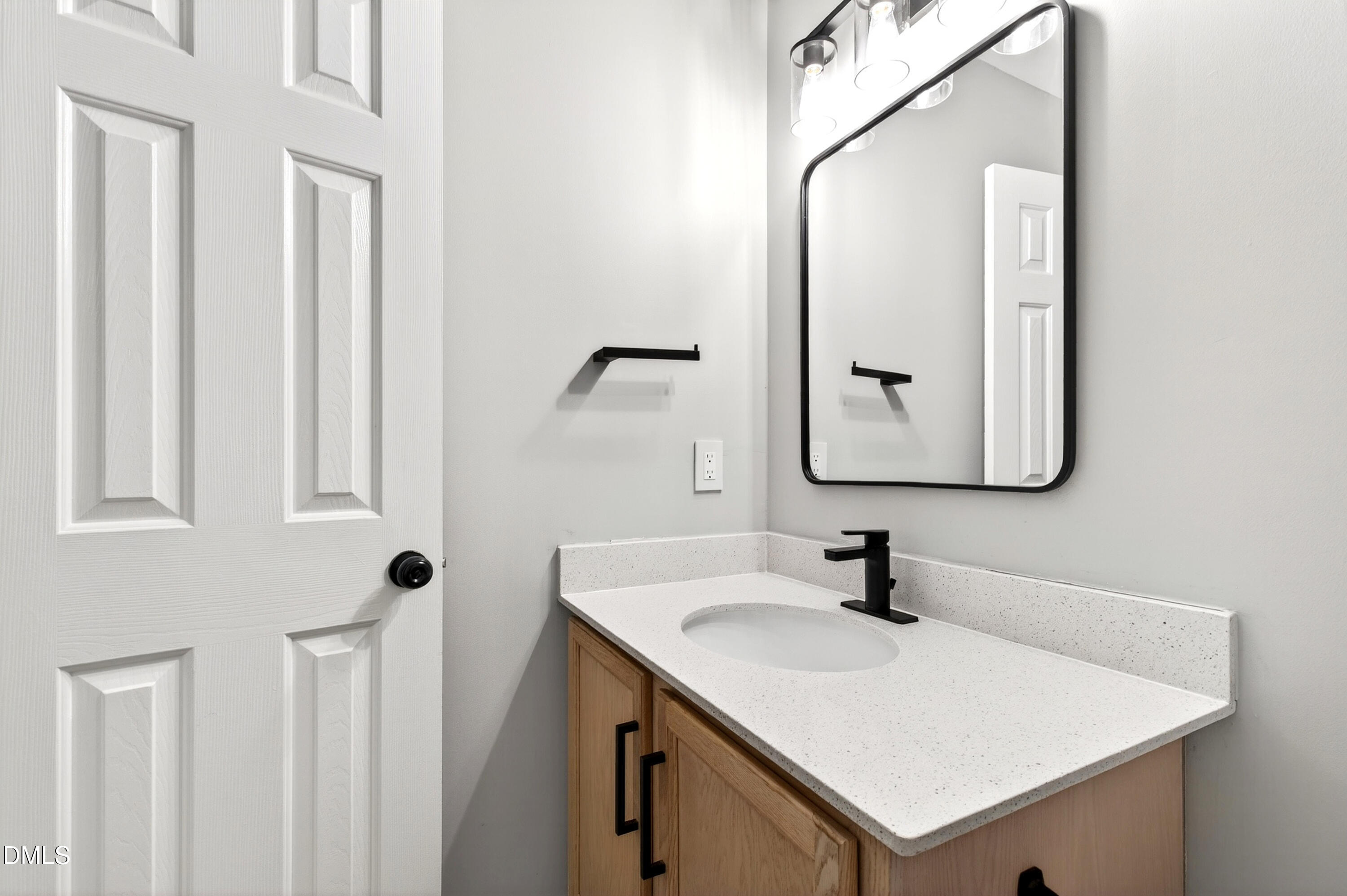 37 Red Lane Raleigh, NC 27606 - Photo 17 of 32 a bathroom with a sink vanity and a mirror