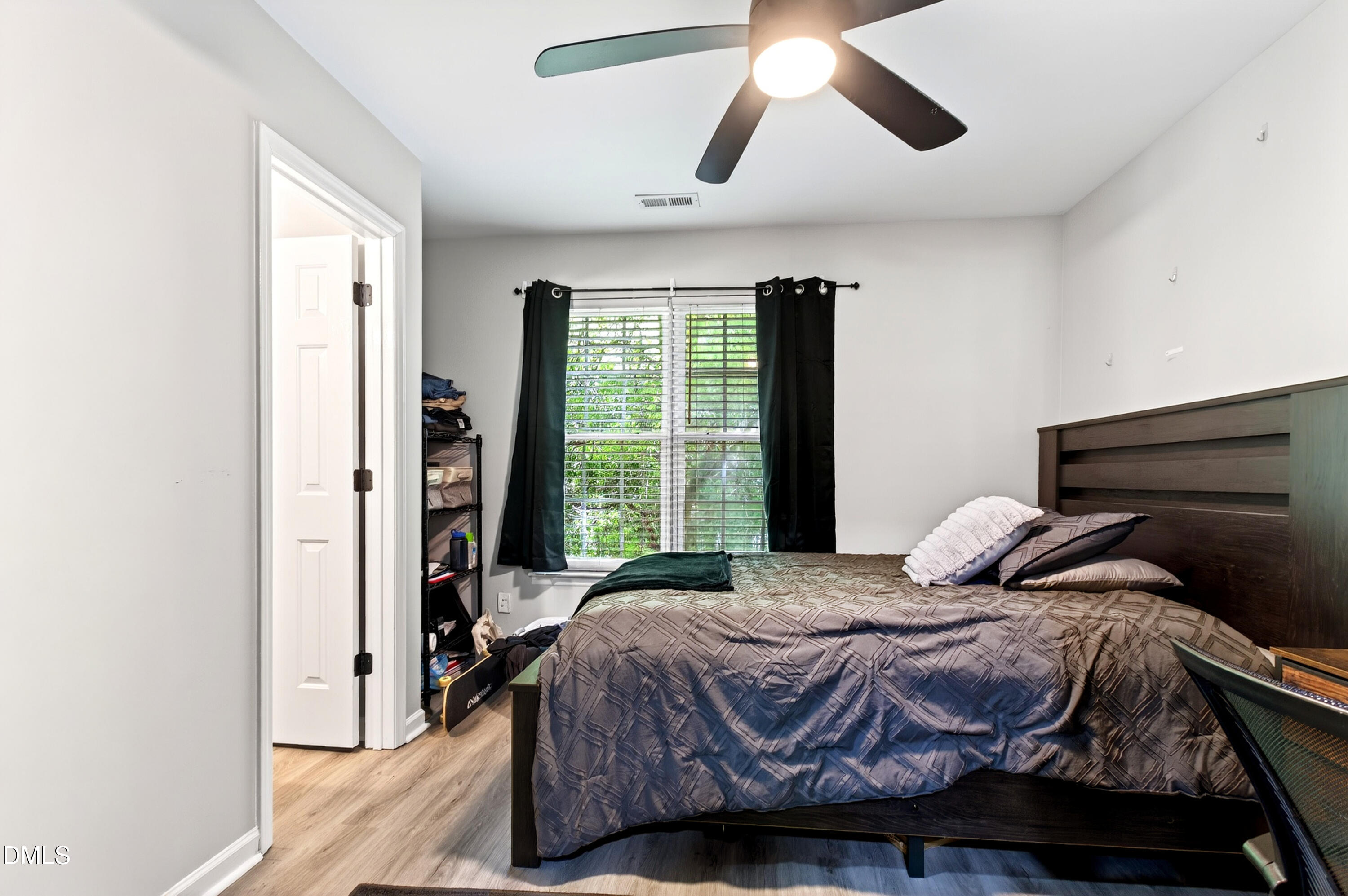 37 Red Lane Raleigh, NC 27606 - Photo 21 of 32 a bedroom with a bed and a large window