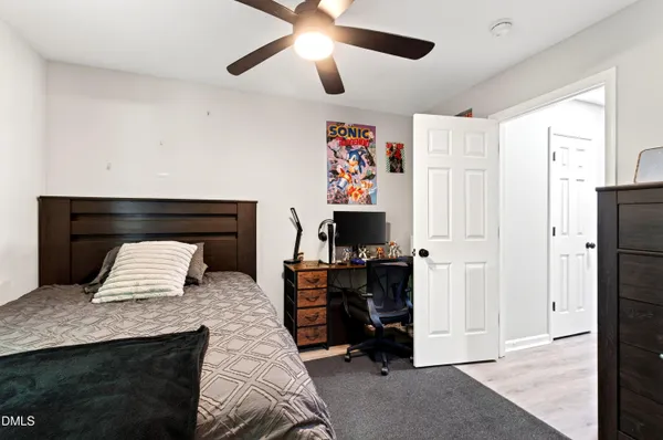 a bedroom with furniture and a fireplace