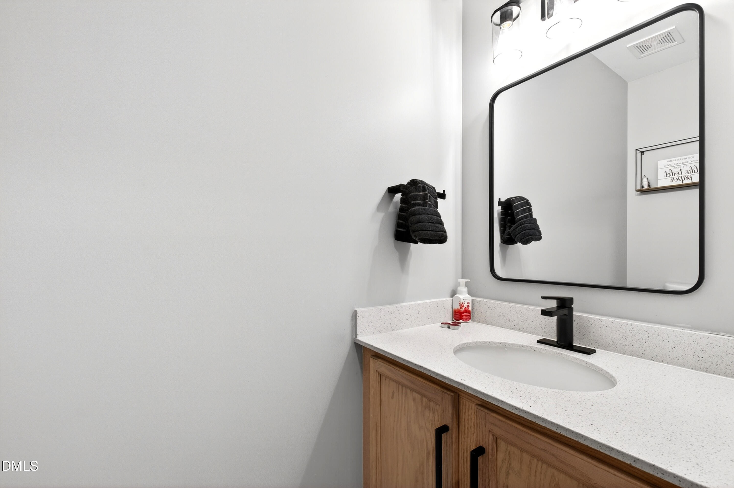 37 Red Lane Raleigh, NC 27606 - Photo 26 of 32 a bathroom with a sink and mirror