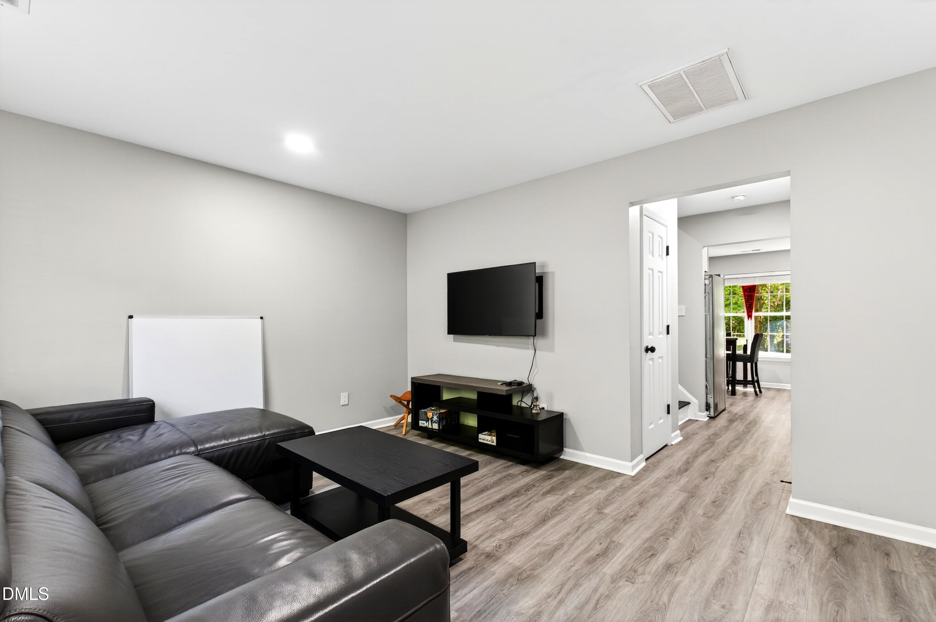 37 Red Lane Raleigh, NC 27606 - Photo 5 of 32 a living room with furniture and a flat screen tv