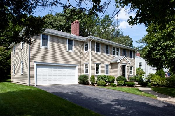 87 Winslow Road Newton, MA 02468 - Photo 1 of 9 a front view of a house with a garden