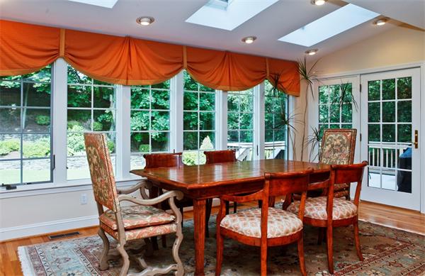 87 Winslow Road Newton, MA 02468 - Photo 2 of 9 a view of a dining room with furniture window and outside view