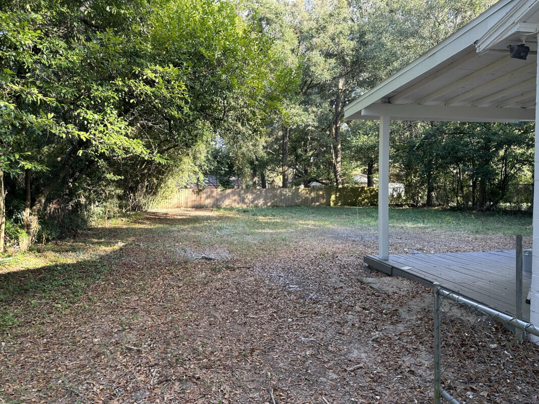 324 Dixie Street Crestview, FL 32536 - Photo 6 of 8 a view of a yard with plants and trees