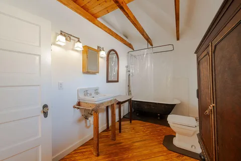 a bedroom with bed and window