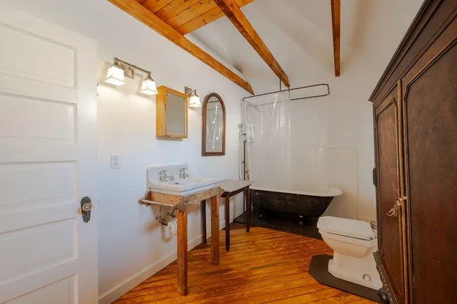 a bedroom with bed and window