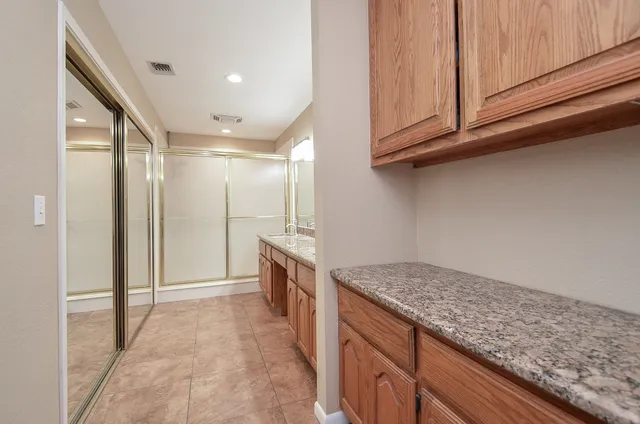 a view of a chair and table in the patio