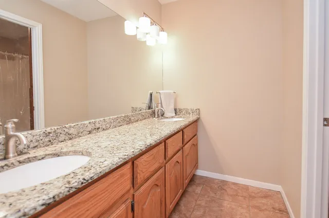 a bathroom with a shower and a toilet