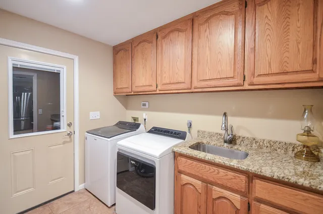 an outdoor space with swimming pool and furniture