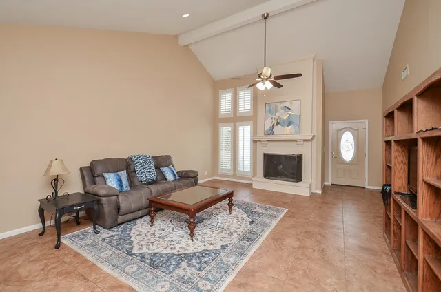 a living room with furniture and large window