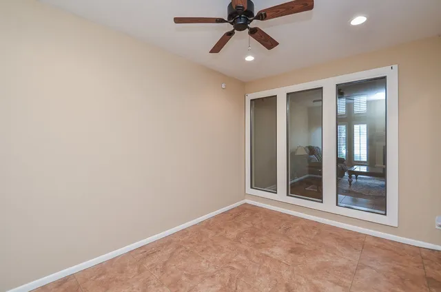 a large kitchen with a table and chairs