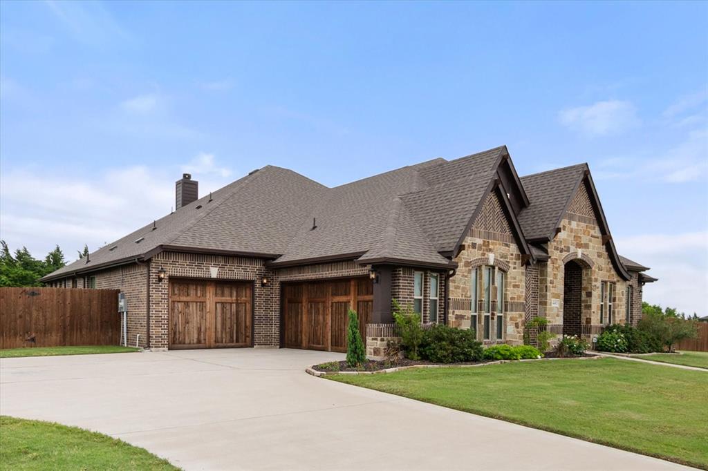 445 Rusty Run Drive Midlothian, TX 76065 - Photo 2 of 40 a front view of a house with a yard