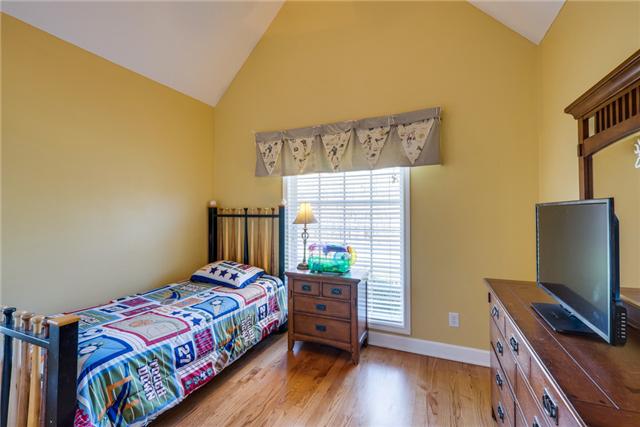 4178 Oregon Road Springfield, TN 37172 - Photo 11 of 20 a bedroom with a bed and wooden floor