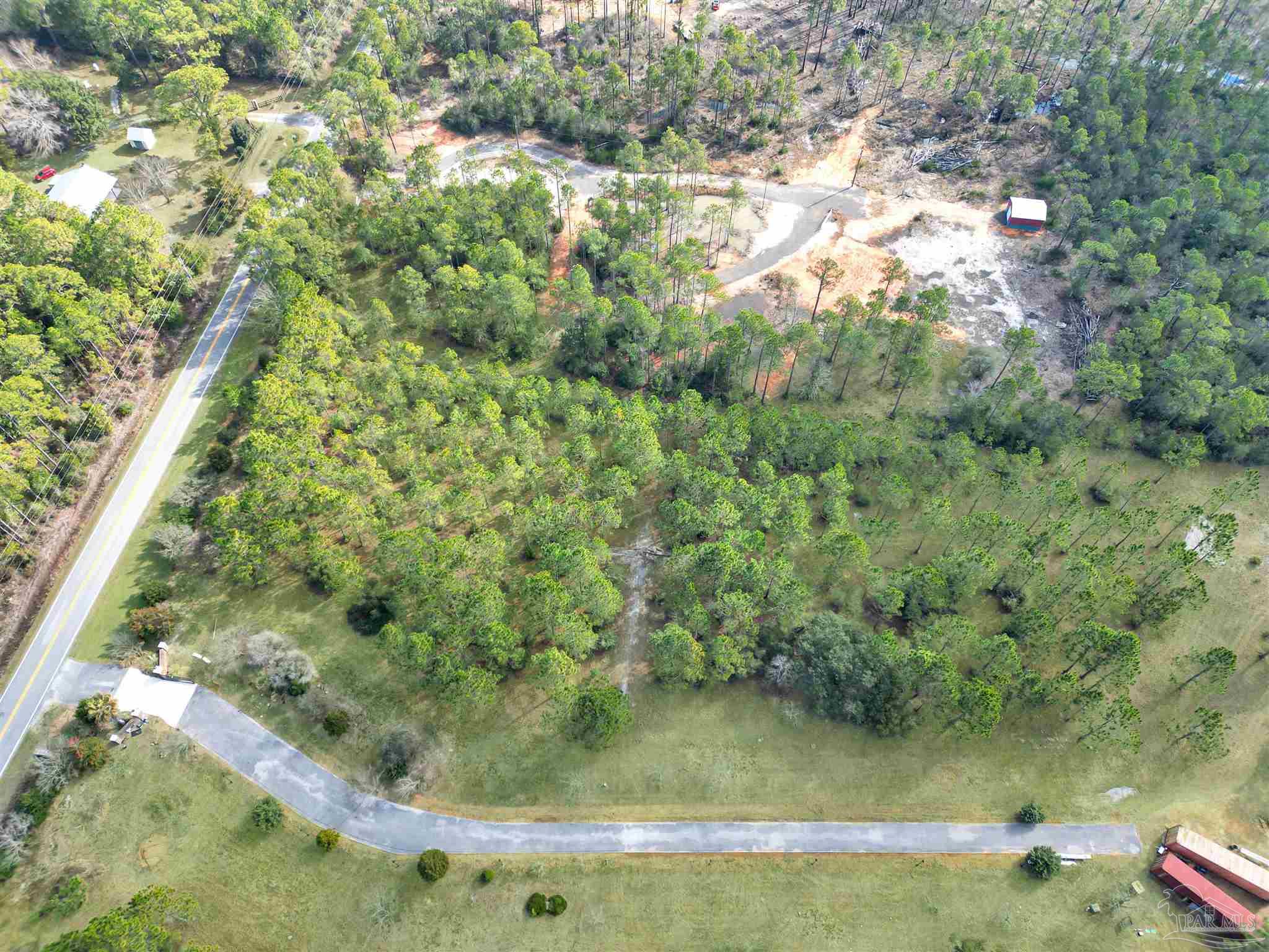 0 Mary Kitchens Road Milton, FL 32583 - Photo 5 of 14 a view of a lake from a yard