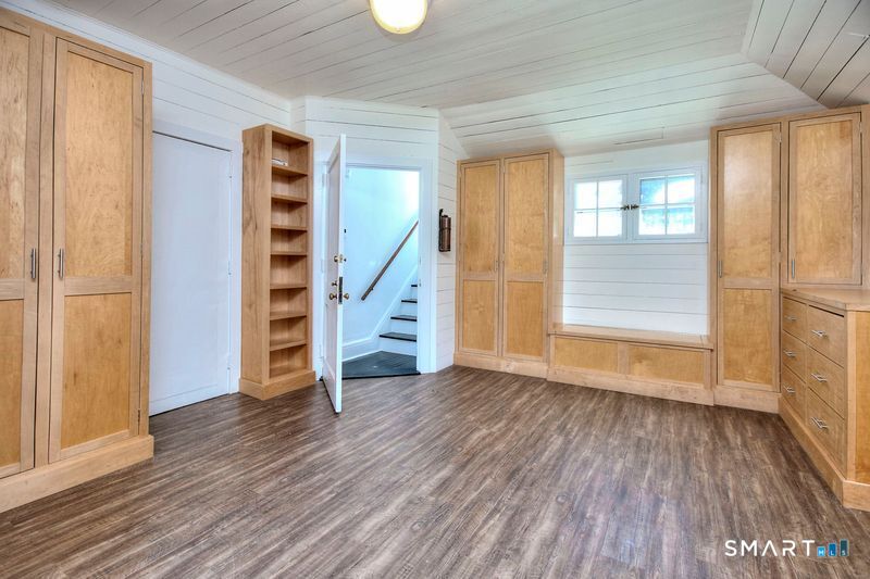 94 Honey Hill Road Wilton, CT 06897 - Photo 2 of 18 wooden floor in an empty room with a window