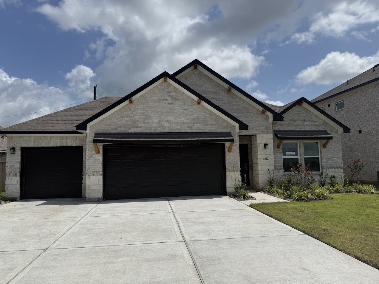 3134 Emerald Hls Drive Angleton, TX 77515 - Photo 1 of 7 a front view of a house with a garden
