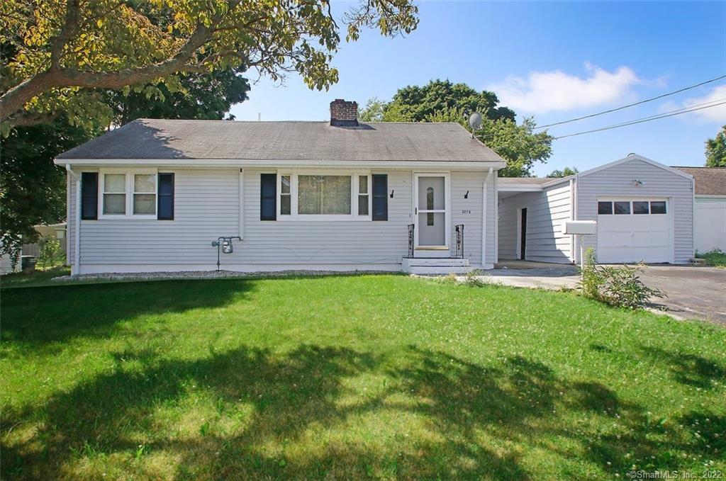 3275 Old Town Road Bridgeport, CT 06606 - Photo 1 of 1 a front view of a house with a garden and yard