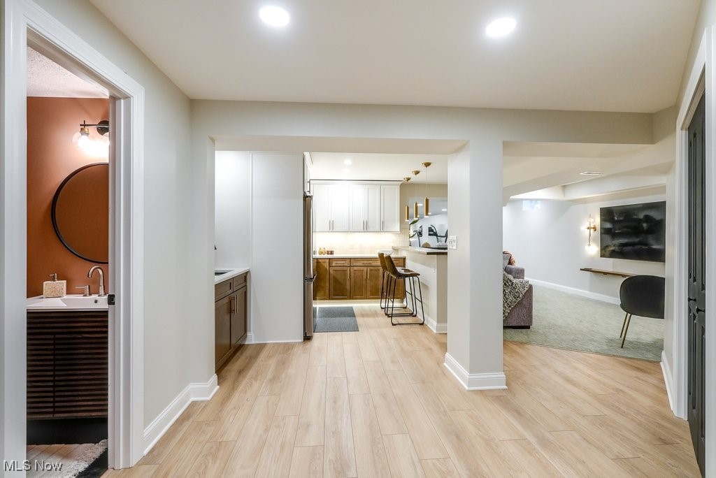 1598 Graham Road Silver Lake, OH 44224 - Photo 39 of 46 Hall featuring light hardwood / wood-style flooring and sink