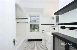 a kitchen with a sink a stove and a refrigerator