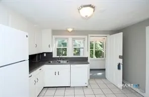 a kitchen with a cabinets and window