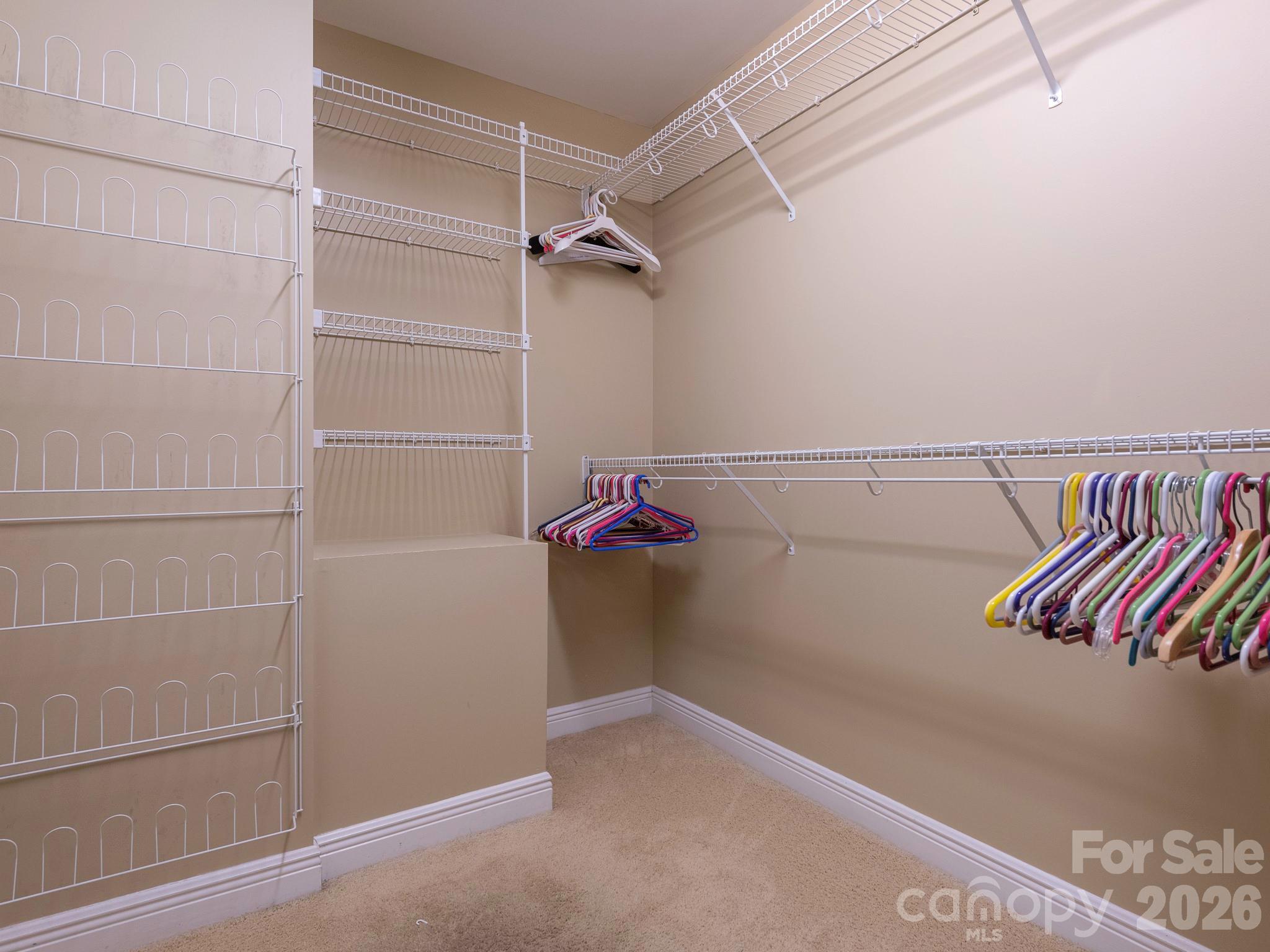 4440 Hucks Road Charlotte, NC 28269 - Photo 20 of 45 a view of walk in closet with clothes and shoes