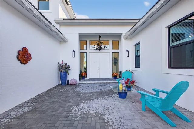 a view of a house with porch and sitting area