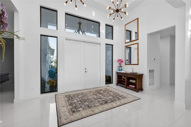 a living room with furniture and painting on the wall