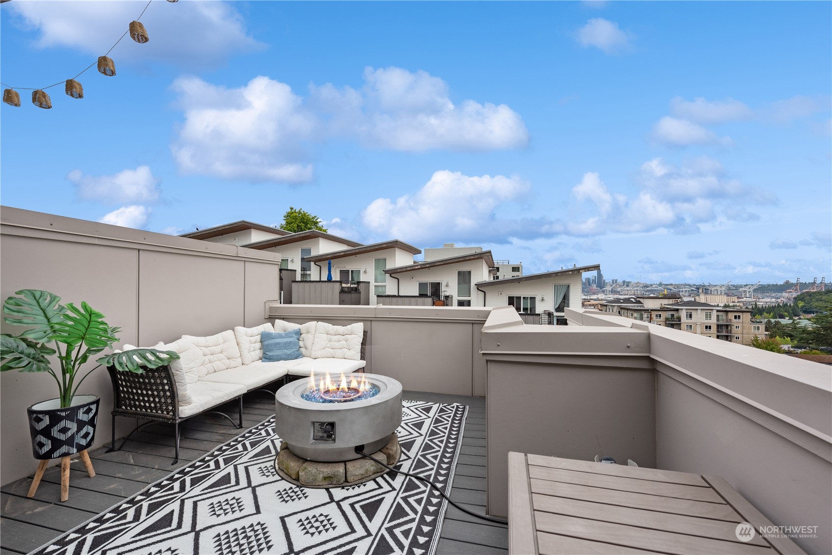 3078 Southwest Avalon Way, Unit G Seattle, WA 98126 - Photo 1 of 25 a view of a terrace with furniture and stove