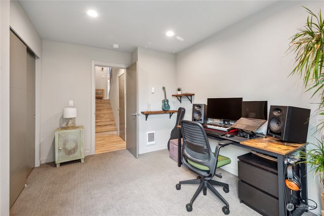 a view of a workspace with furniture