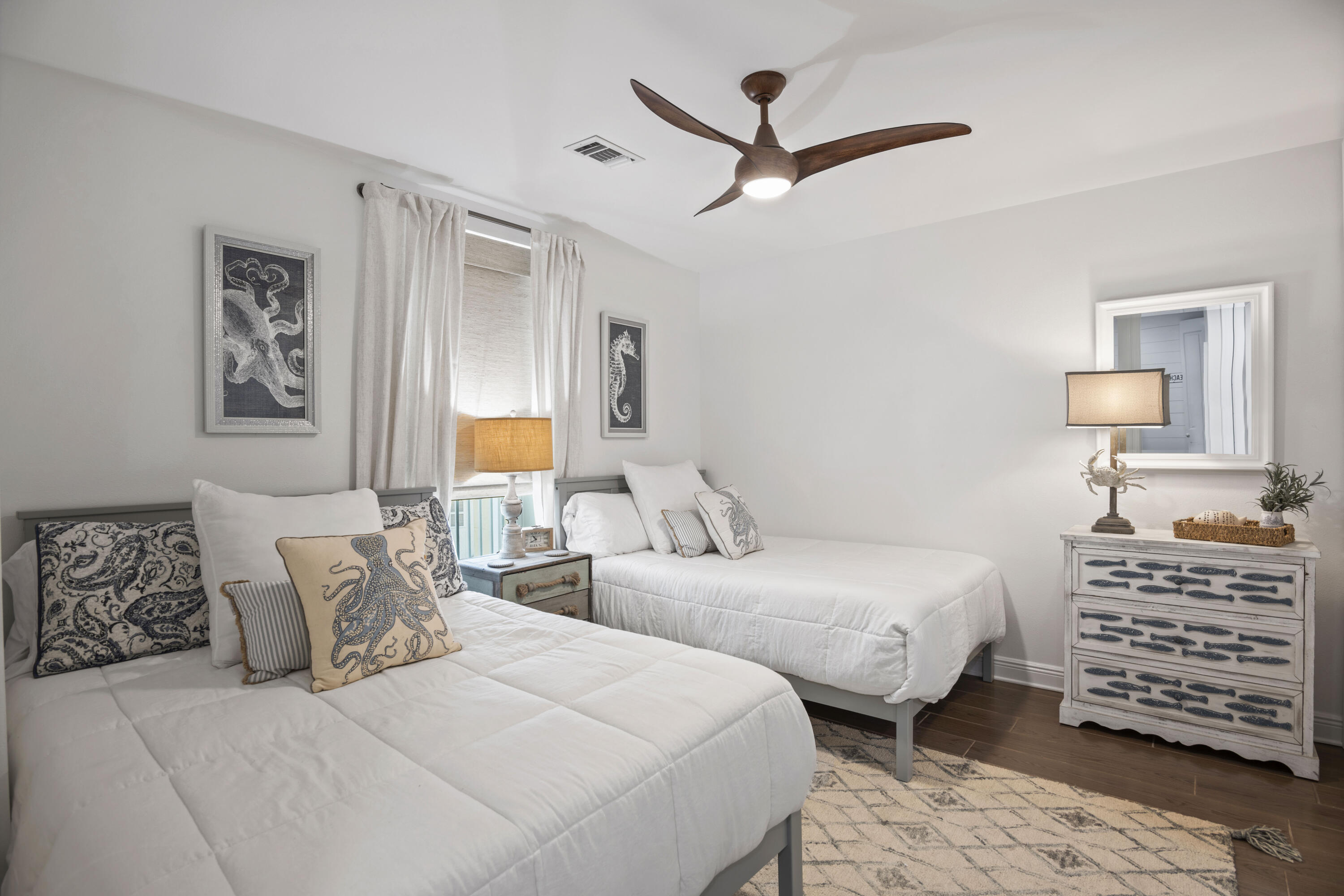 1740 South County Highway, Unit 203 Santa Rosa Beach, FL 32459 - Photo 13 of 40 a bedroom with two beds and painting on the wall