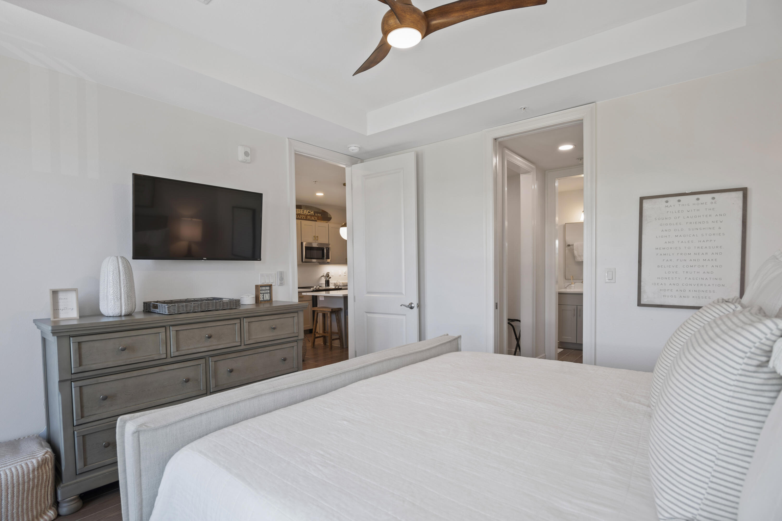 1740 South County Highway, Unit 203 Santa Rosa Beach, FL 32459 - Photo 19 of 40 a bedroom with a bed and a flat screen tv in it