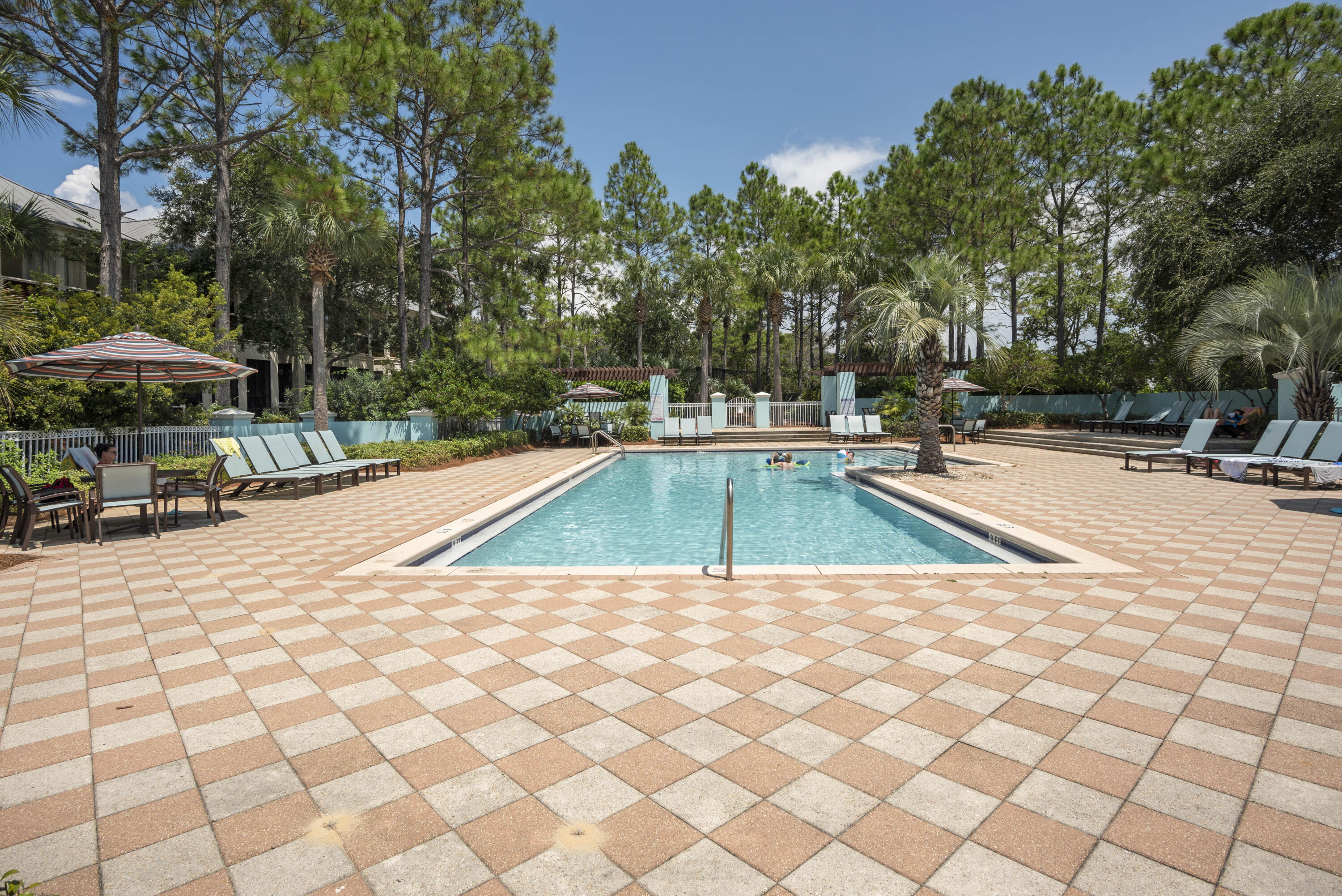 1740 South County Highway, Unit 203 Santa Rosa Beach, FL 32459 - Photo 25 of 40 a view of a swimming pool with an outdoor space and seating area