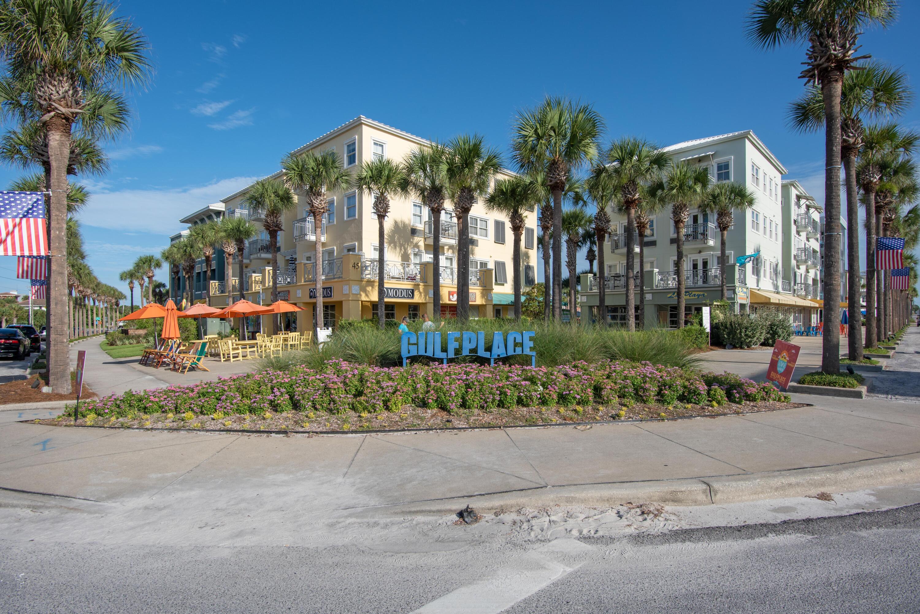 1740 South County Highway, Unit 203 Santa Rosa Beach, FL 32459 - Photo 38 of 40 front view of a house with a yard and potted plants