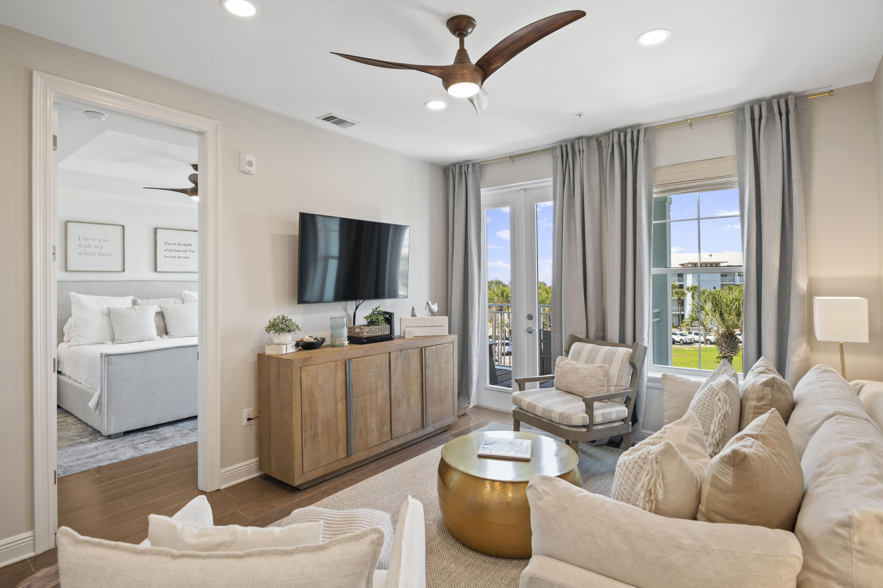 1740 South County Highway, Unit 203 Santa Rosa Beach, FL 32459 - Photo 6 of 40 a living room with furniture and a flat screen tv