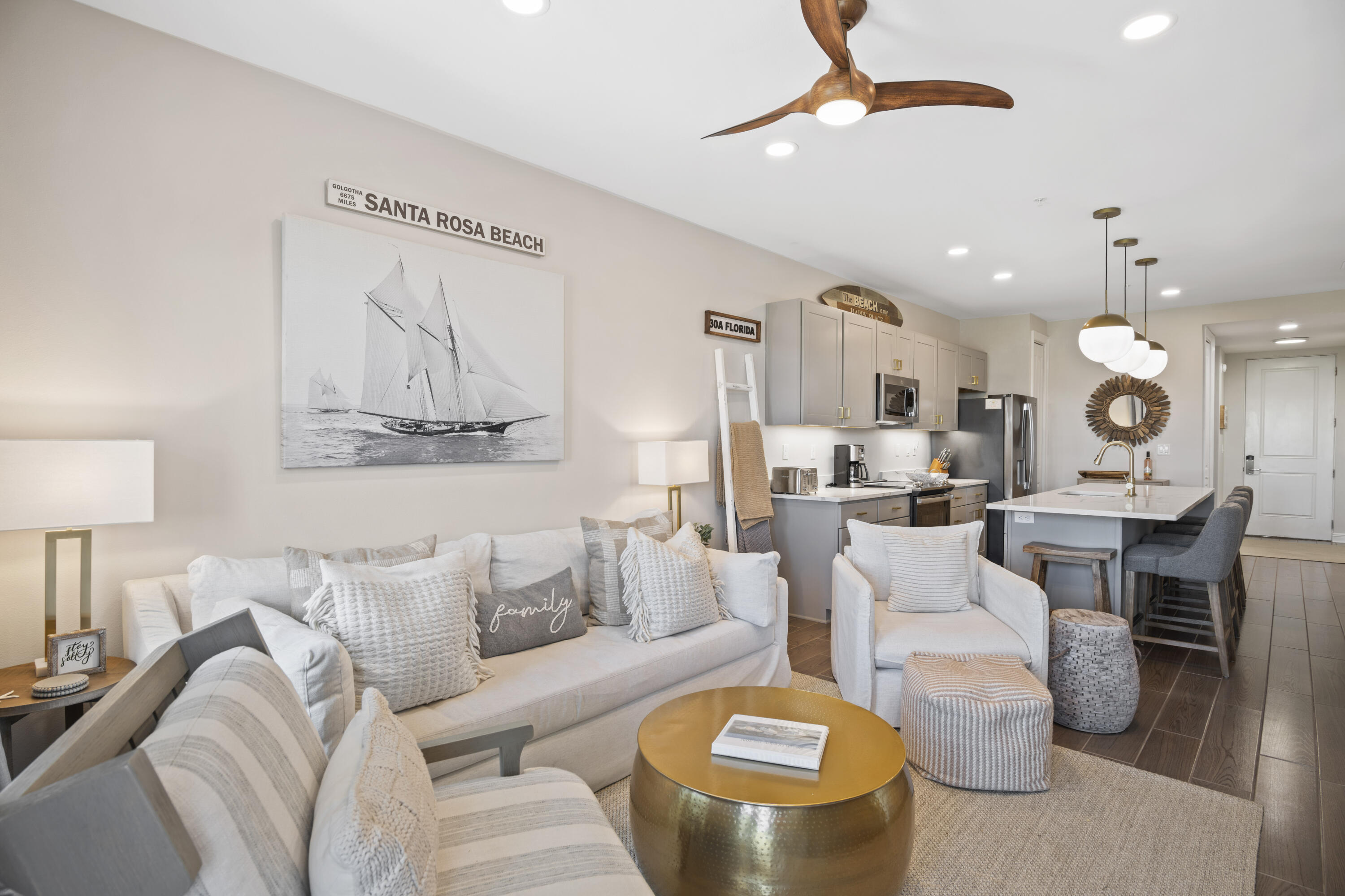 1740 South County Highway, Unit 203 Santa Rosa Beach, FL 32459 - Photo 7 of 40 a living room with furniture kitchen view and a chandelier