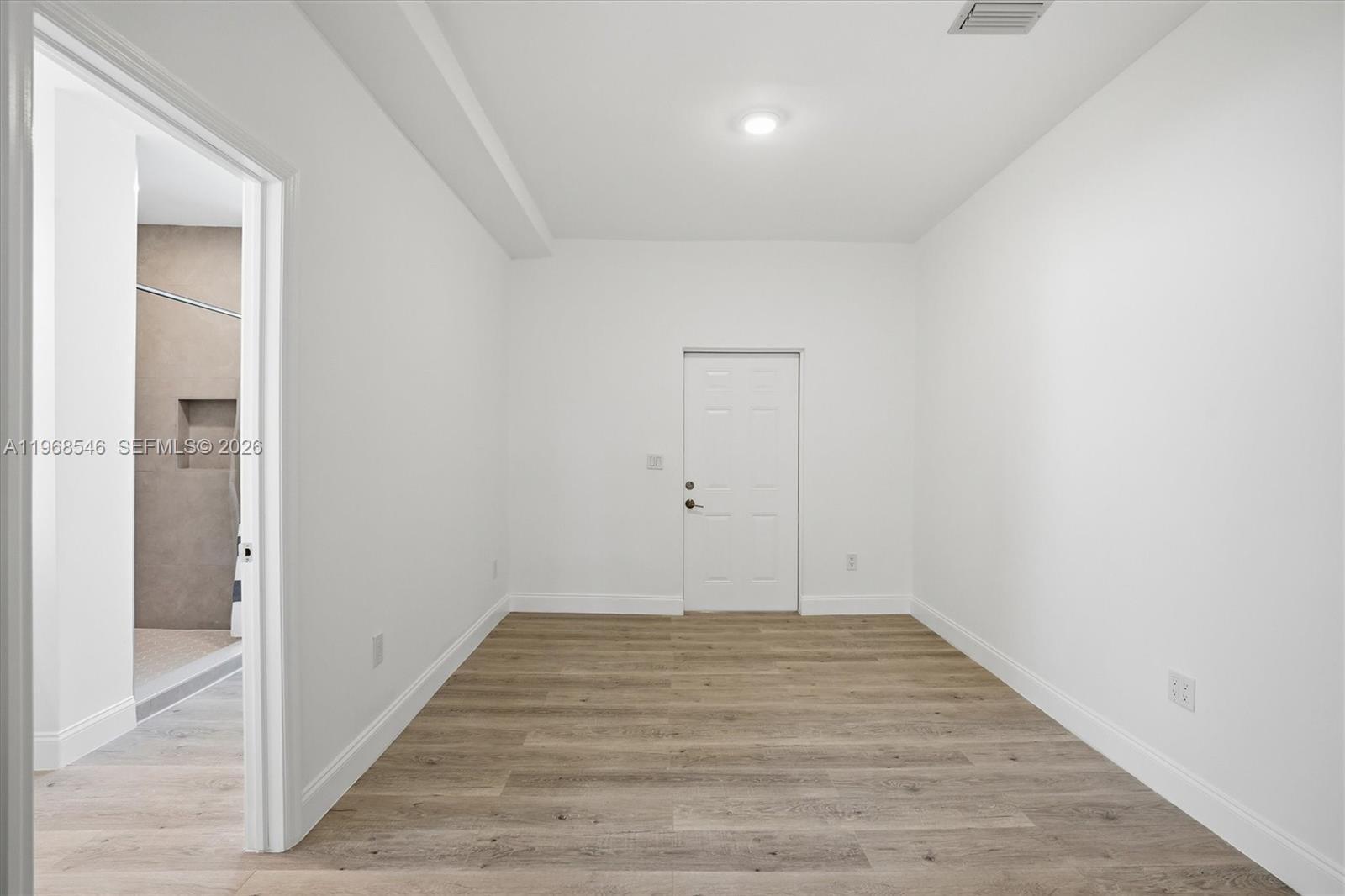 4237 Southwest 7th Street Miami, FL 33134 - Photo 12 of 31 a view of a room with wooden floor