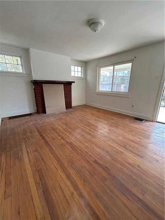 1317 Old Freeport Road Pittsburgh, PA 15238 - Photo 12 of 49 a view of an empty room with wooden floor and a window