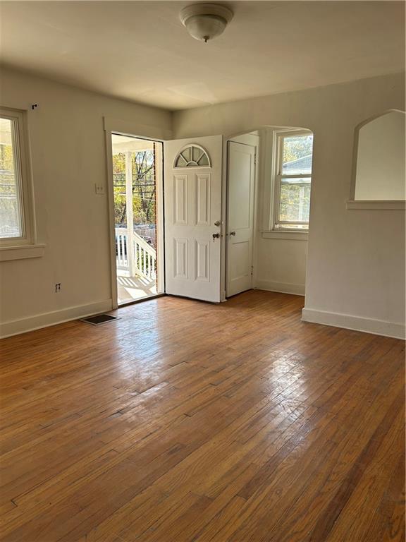 1317 Old Freeport Road Pittsburgh, PA 15238 - Photo 13 of 49 a view of an empty room with wooden floor and a window
