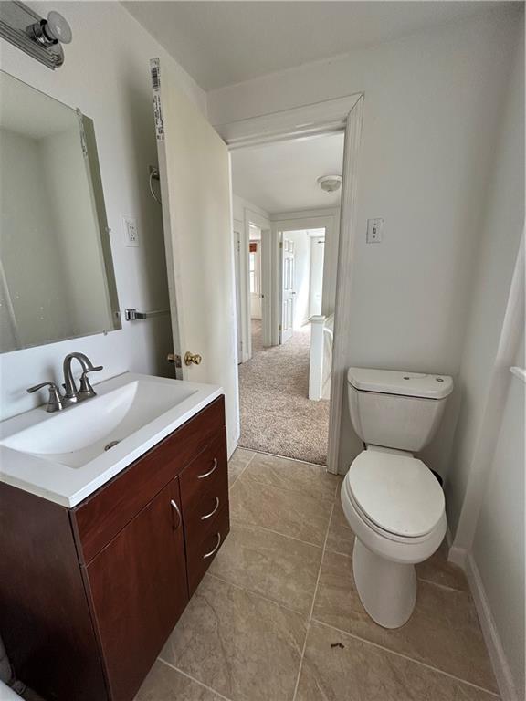 1317 Old Freeport Road Pittsburgh, PA 15238 - Photo 24 of 49 a spacious bathroom with a toilet sink and mirror