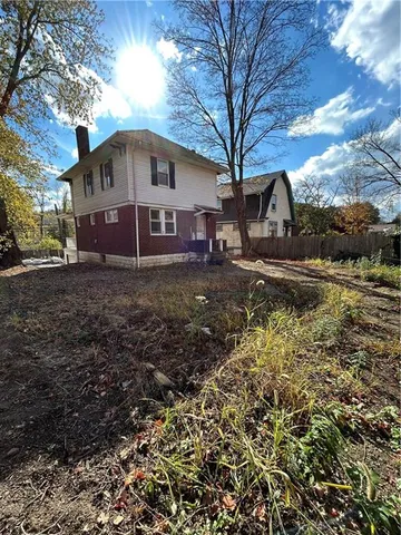 a view of a yard with potted plants