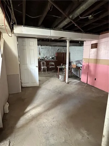 a brick building with a bench and a window