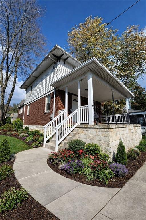 1317 Old Freeport Road Pittsburgh, PA 15238 - Photo 3 of 49 a front view of a house with garden