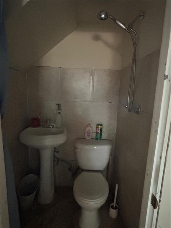 1317 Old Freeport Road Pittsburgh, PA 15238 - Photo 38 of 38 a bathroom with a toilet sink and mirror