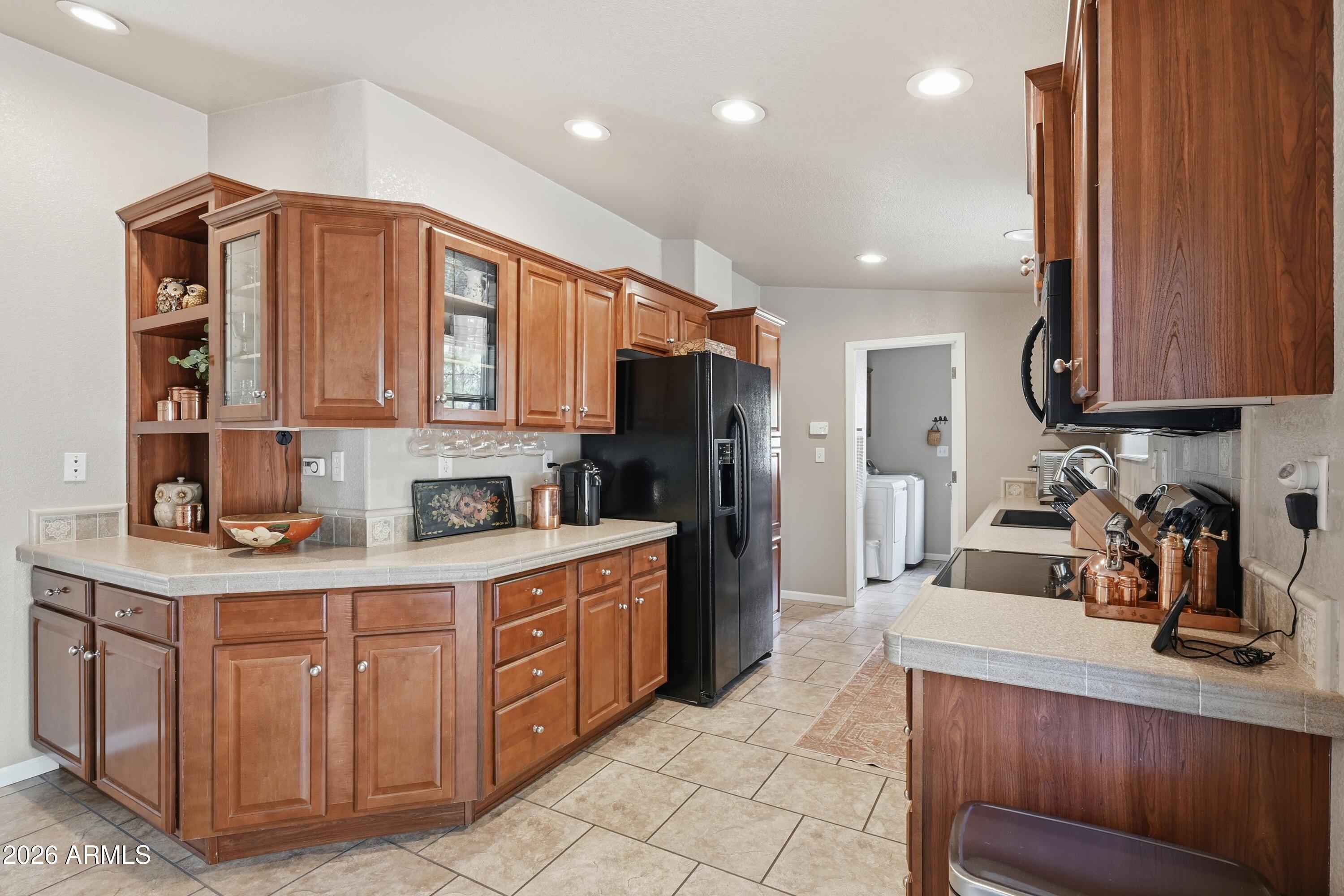 2381 Blue Ridge Drive Happy Jack, AZ 86024 - Photo 13 of 45 a kitchen with stainless steel appliances granite countertop a refrigerator and a stove top oven