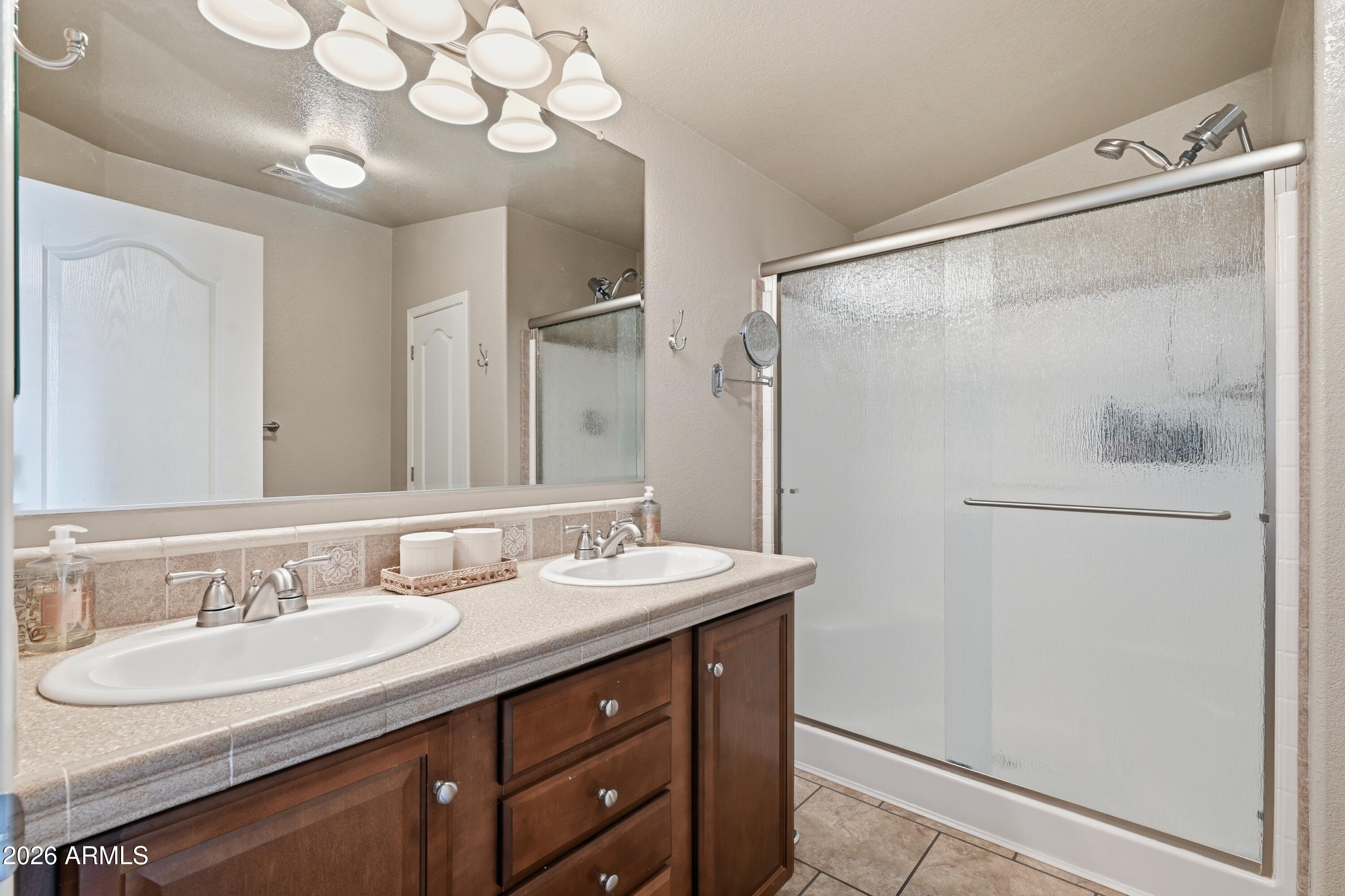 2381 Blue Ridge Drive Happy Jack, AZ 86024 - Photo 19 of 45 a bathroom with a sink vanity granite and a mirror