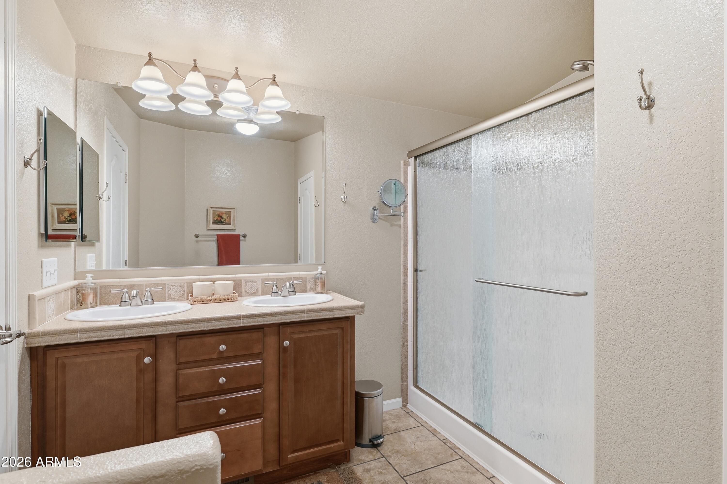 2381 Blue Ridge Drive Happy Jack, AZ 86024 - Photo 20 of 45 a bathroom with a sink vanity and a mirror