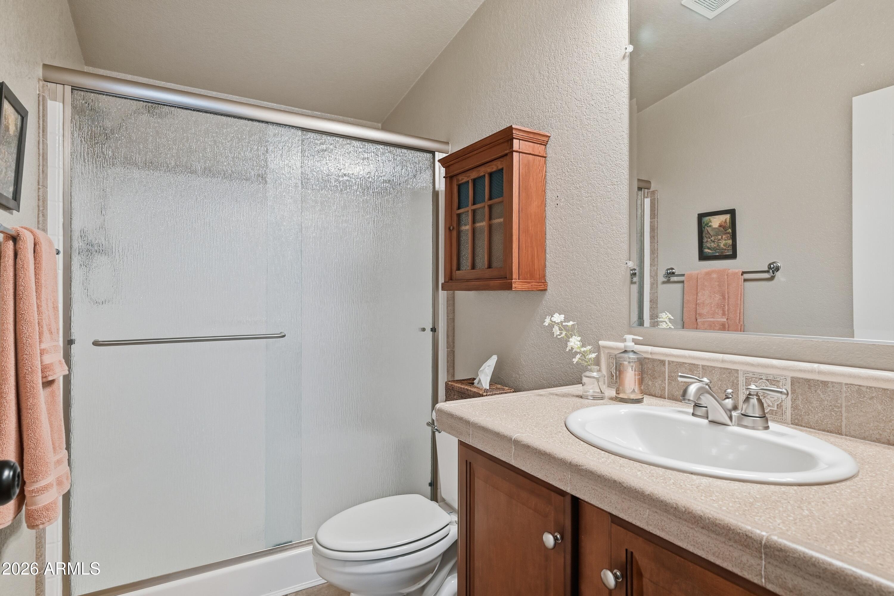 2381 Blue Ridge Drive Happy Jack, AZ 86024 - Photo 23 of 45 a bathroom with a granite countertop sink toilet and shower
