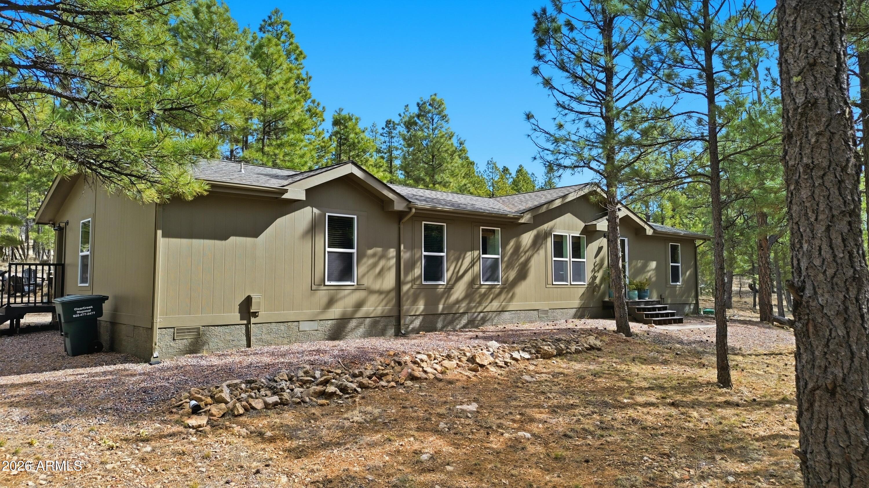2381 Blue Ridge Drive Happy Jack, AZ 86024 - Photo 29 of 45 a view of a house with a yard