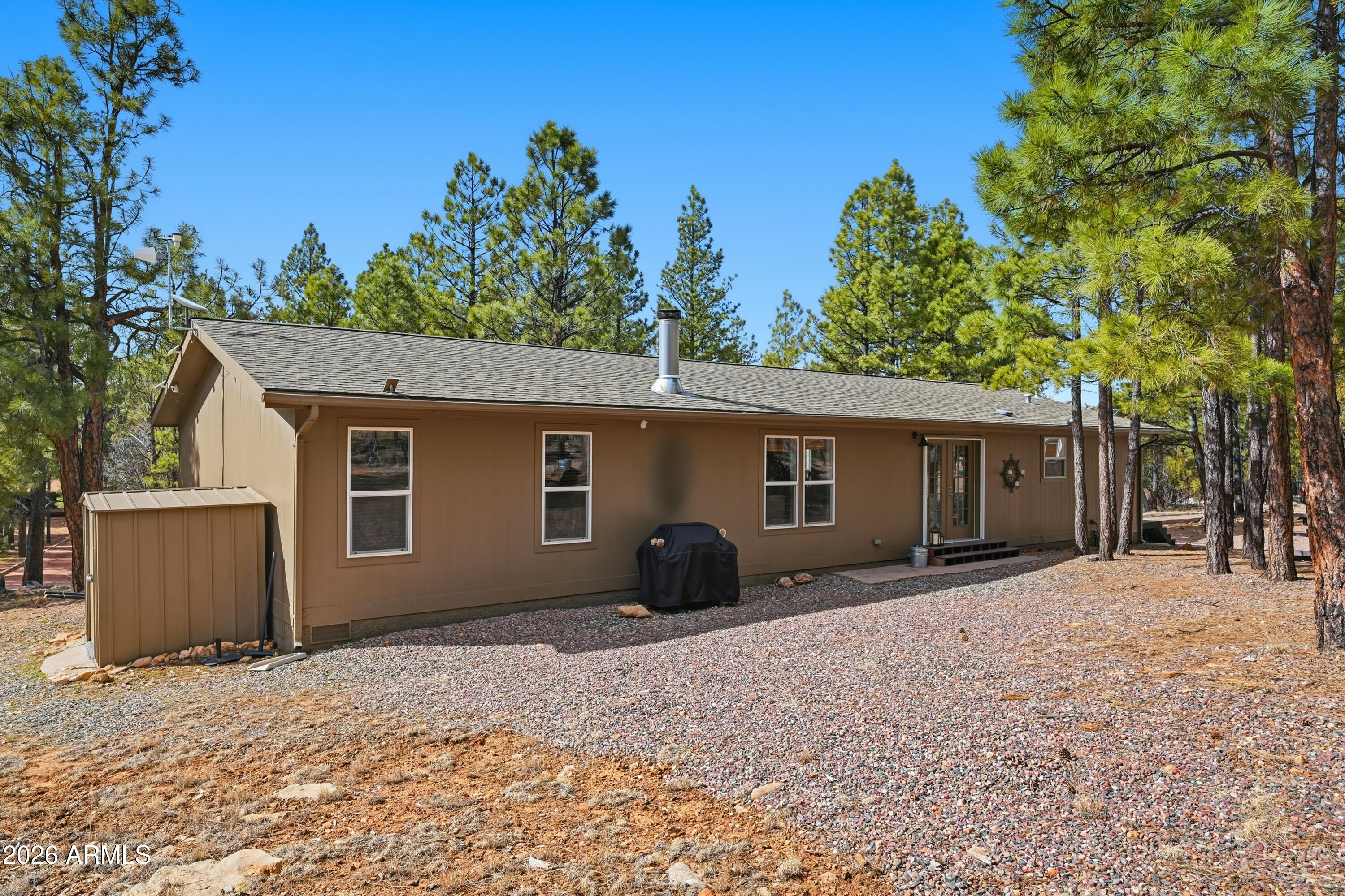 2381 Blue Ridge Drive Happy Jack, AZ 86024 - Photo 33 of 45 front view of a house with a yard